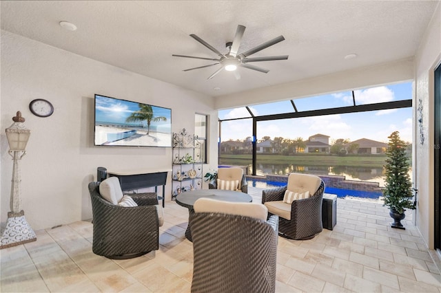 view of patio / terrace with a lanai and ceiling fan