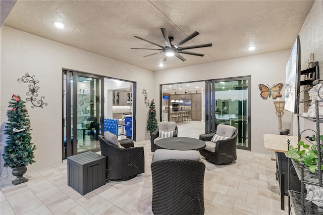 view of patio featuring ceiling fan