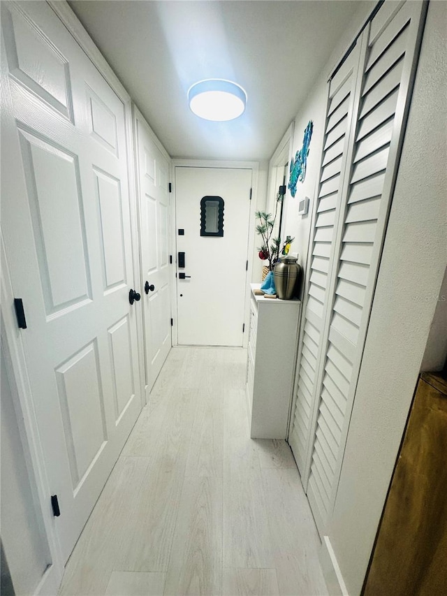 hallway featuring light wood-type flooring