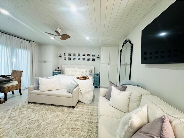 bedroom featuring ceiling fan and wooden ceiling