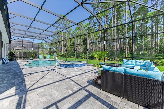 view of swimming pool featuring an in ground hot tub, an outdoor hangout area, a patio area, and a lanai