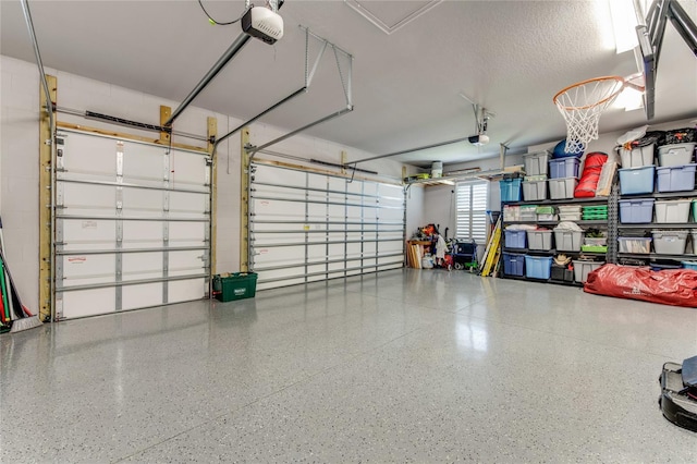 garage featuring a garage door opener