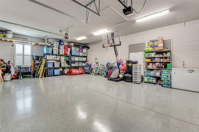 garage featuring a garage door opener