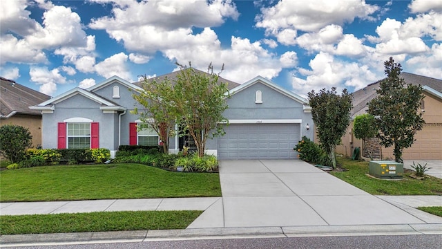 view of front facade with a garage and a front lawn