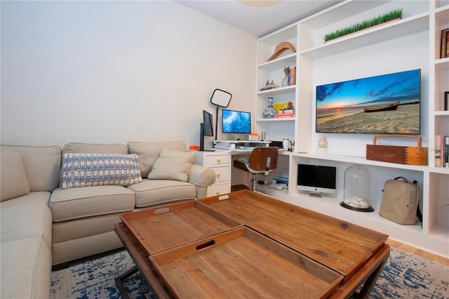 living room with hardwood / wood-style floors and built in desk