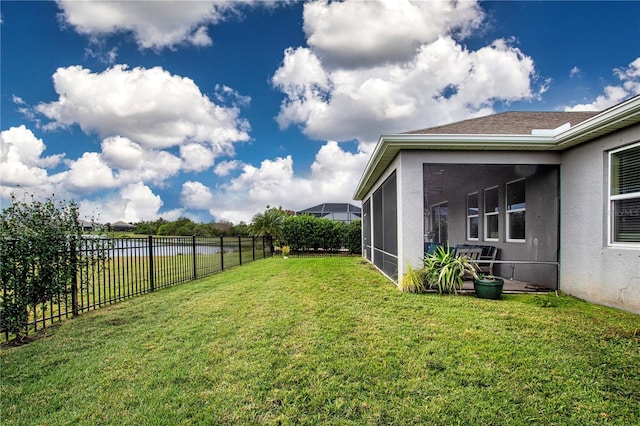 view of yard featuring a sunroom