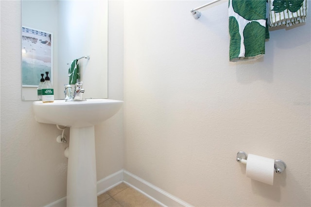 bathroom with tile patterned floors