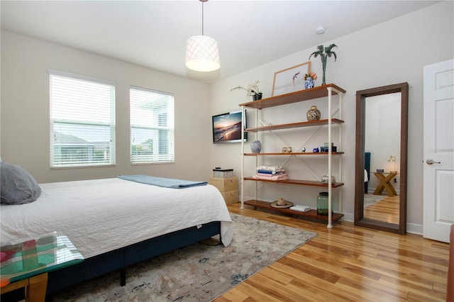 bedroom with hardwood / wood-style floors