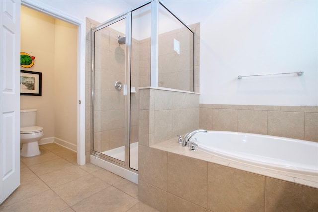 bathroom featuring tile patterned floors, toilet, and independent shower and bath