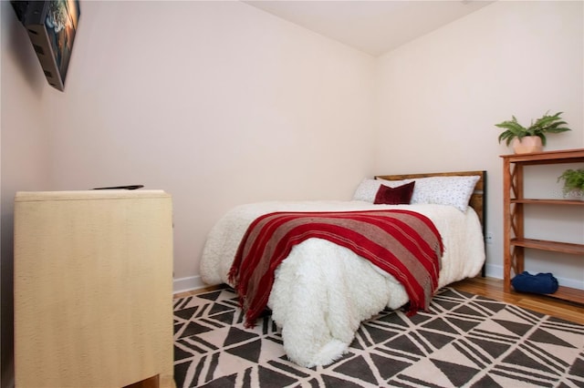 bedroom featuring wood-type flooring