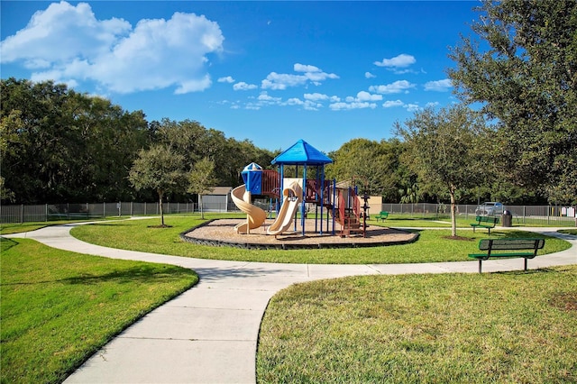 view of play area featuring a lawn