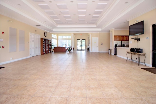 living room featuring a tray ceiling, crown molding, and light tile patterned floors