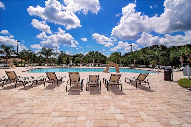 view of swimming pool featuring a patio area