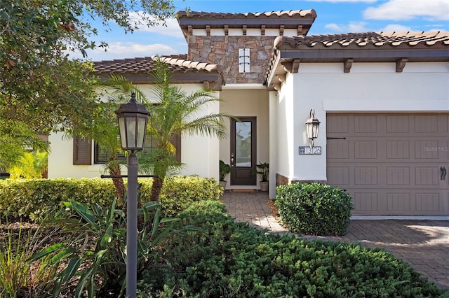 mediterranean / spanish home featuring a garage