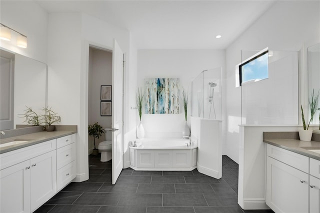 full bathroom featuring tile patterned floors, vanity, toilet, and independent shower and bath