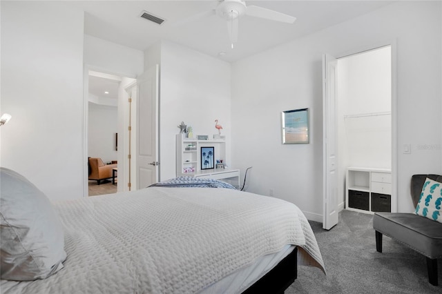 bedroom with ceiling fan and light carpet