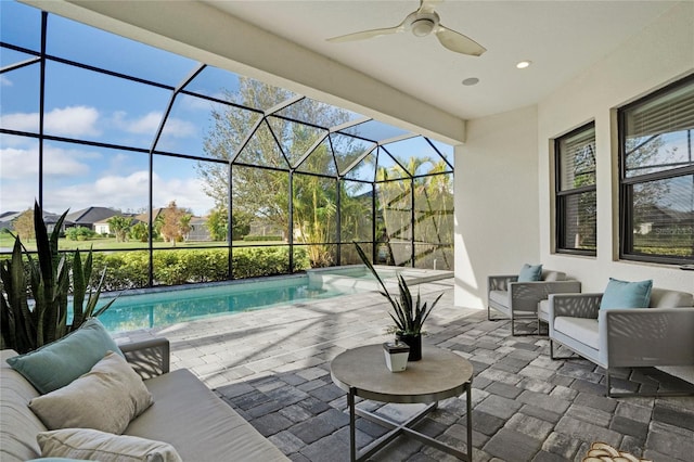 view of patio / terrace with outdoor lounge area, glass enclosure, and ceiling fan