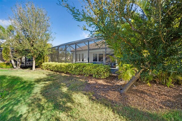 13126 Indigo Way, Bradenton, FL 34211 - view of grassy yard featuring glass enclosure