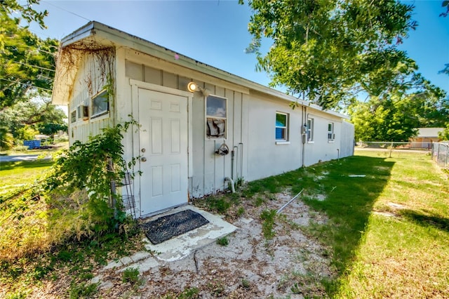 view of outdoor structure featuring a lawn