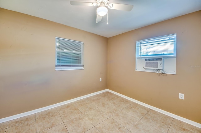 unfurnished room with ceiling fan, cooling unit, and light tile patterned floors