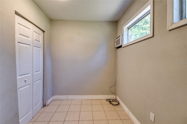 laundry room with light tile patterned floors