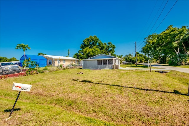 view of front of home with a front yard