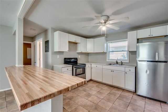 kitchen featuring ceiling fan, sink, stainless steel appliances, light tile patterned floors, and white cabinets