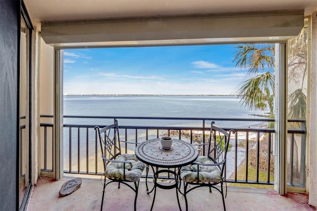 balcony featuring a water view