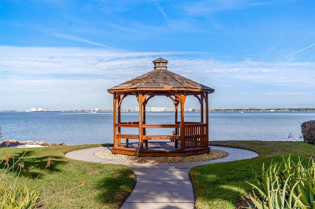 view of dock featuring a gazebo and a water view