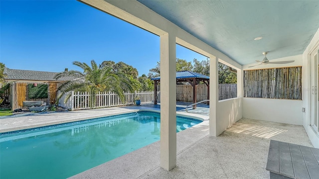 view of pool featuring a gazebo, a patio, and ceiling fan