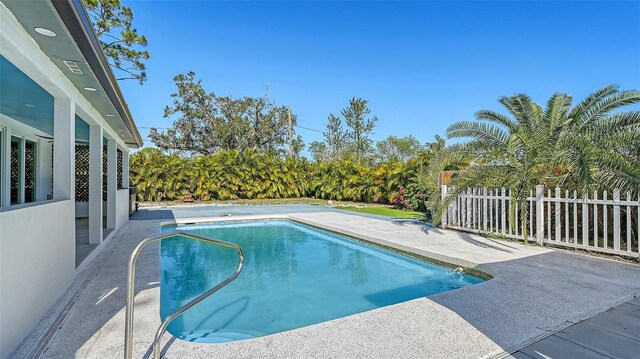 view of pool featuring a patio