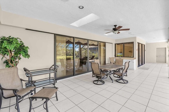 view of patio featuring ceiling fan