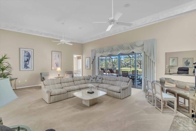 living room with baseboards, ceiling fan, carpet flooring, and crown molding