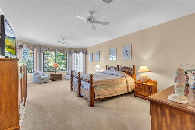 bedroom featuring ceiling fan, light colored carpet, and ornamental molding