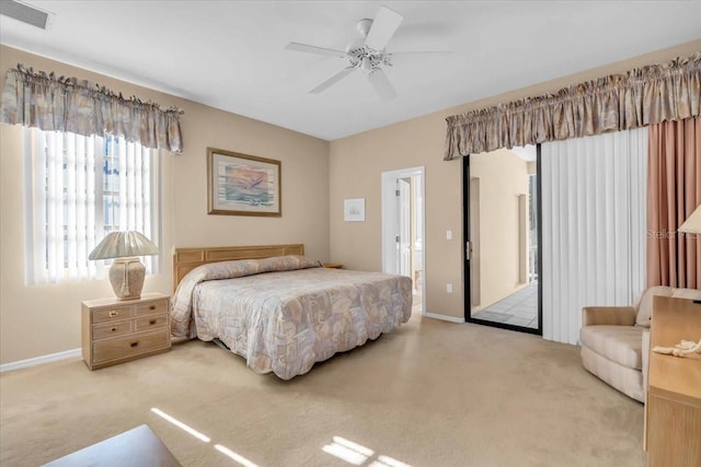 bedroom with visible vents, carpet flooring, a ceiling fan, and baseboards