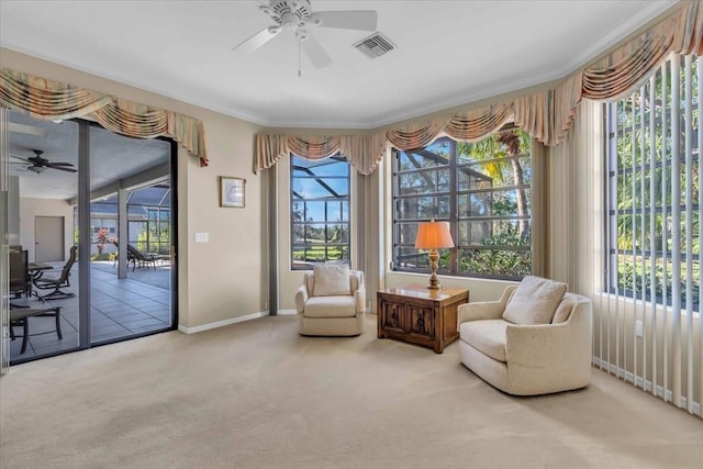 sitting room featuring plenty of natural light, carpet, visible vents, and a sunroom