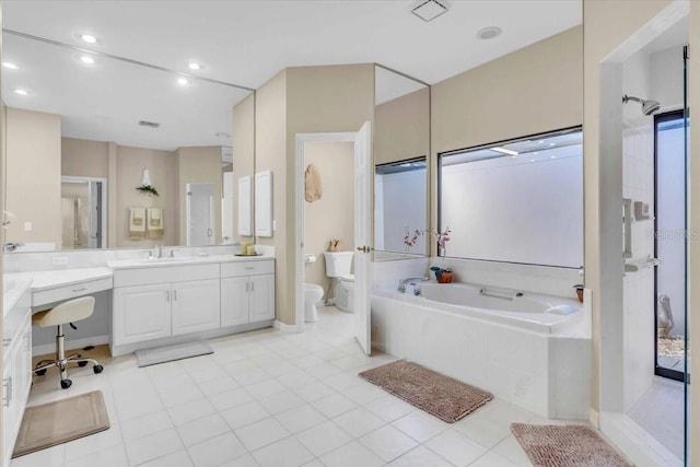 full bath with a garden tub, toilet, recessed lighting, tile patterned flooring, and vanity