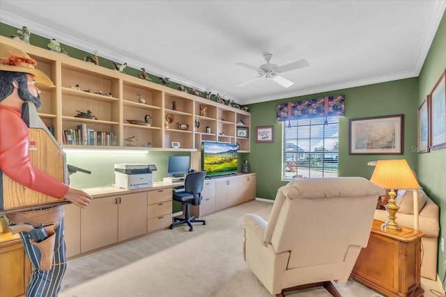 office area featuring ceiling fan, light colored carpet, and ornamental molding