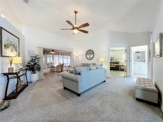 living room featuring carpet floors, high vaulted ceiling, and ceiling fan