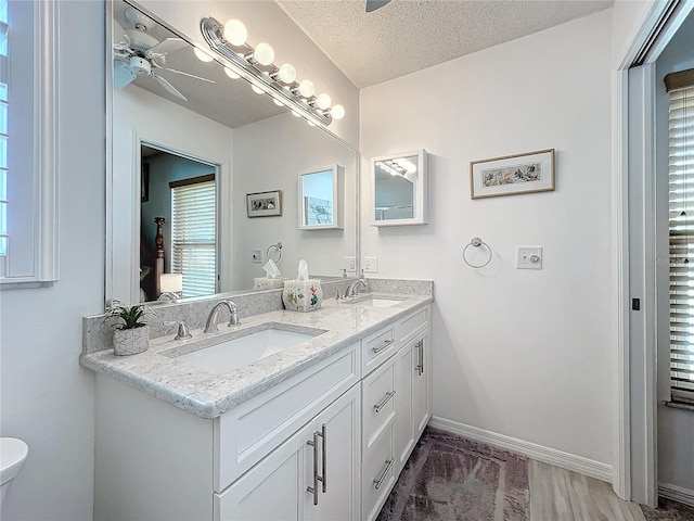 bathroom featuring vanity and a textured ceiling