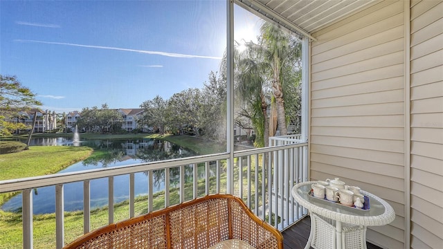 balcony featuring a water view