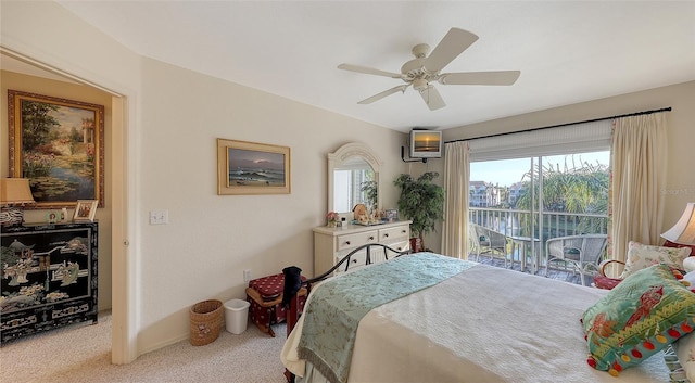 bedroom with access to exterior, light colored carpet, and ceiling fan