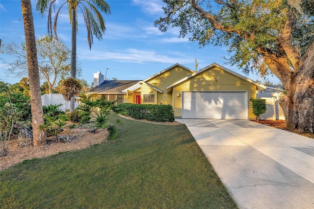 ranch-style house with a front yard and a garage