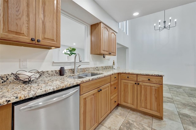 kitchen with light stone countertops, an inviting chandelier, stainless steel dishwasher, and sink