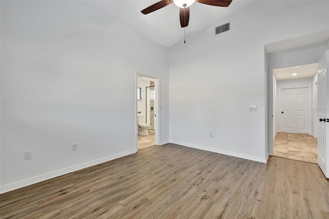 unfurnished room featuring light wood-type flooring, high vaulted ceiling, and ceiling fan