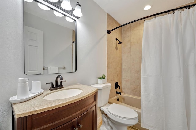 full bathroom featuring vanity, shower / bath combination with curtain, and toilet