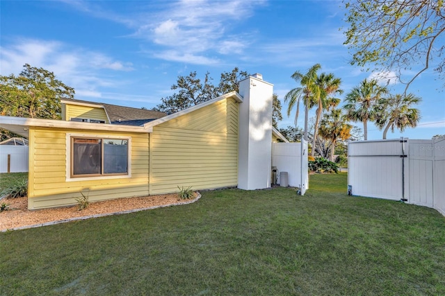 view of property exterior featuring a lawn