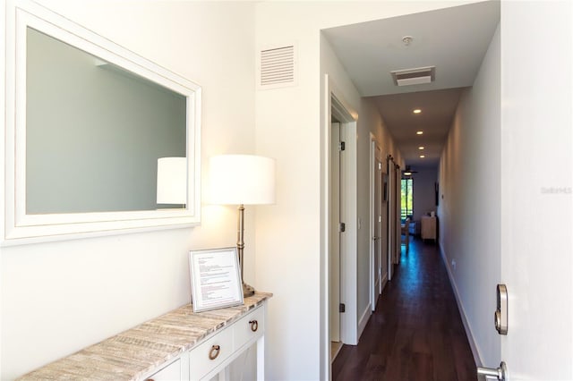 hallway with dark hardwood / wood-style flooring