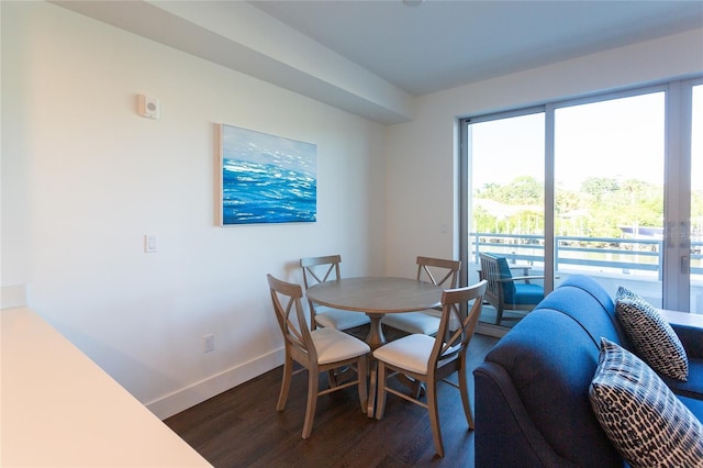 dining area with dark hardwood / wood-style floors