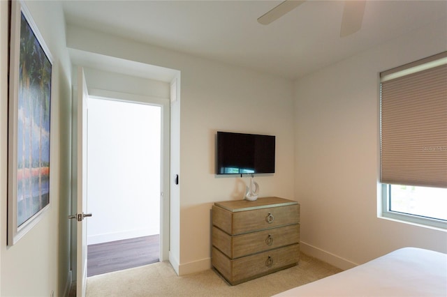 carpeted bedroom featuring ceiling fan